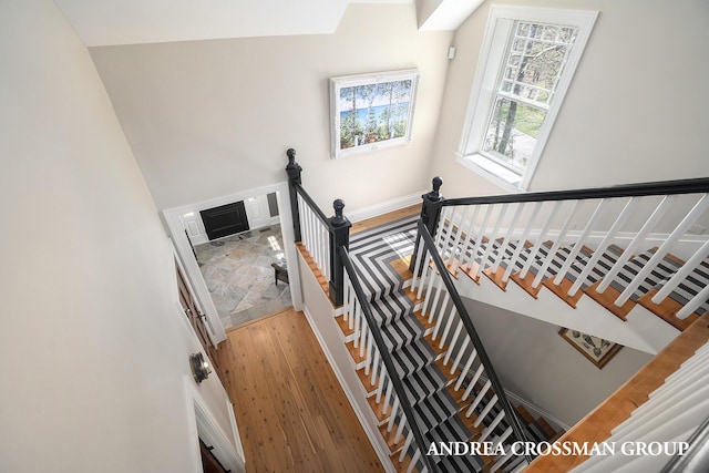 6059 Lakeshore Dr, West Olive, MI 49460 - stairs featuring baseboards and wood finished floors
