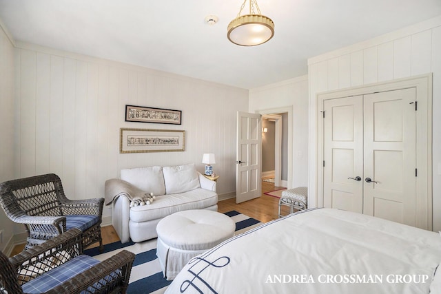 6059 Lakeshore Dr, West Olive, MI 49460 - bedroom with a closet, wood finished floors, and baseboards