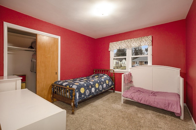 carpeted bedroom featuring a closet