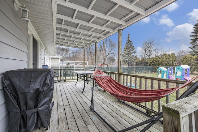 deck with a fenced backyard