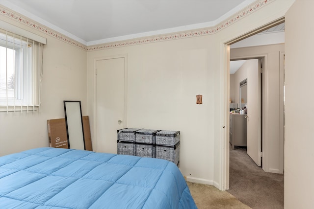 bedroom featuring carpet and baseboards