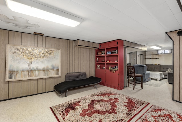 living area featuring wooden walls