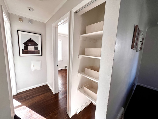 interior space with dark wood finished floors and baseboards