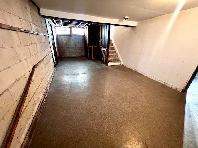 below grade area with stairs and tile patterned floors