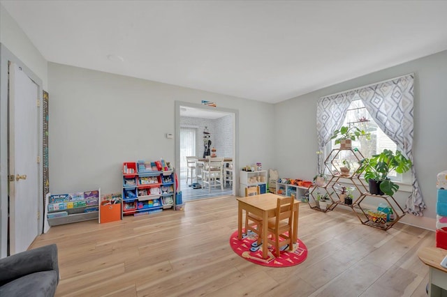 recreation room featuring wood finished floors