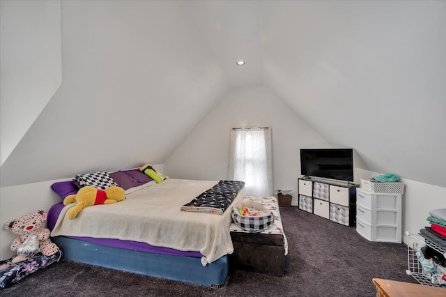 bedroom with lofted ceiling and carpet flooring