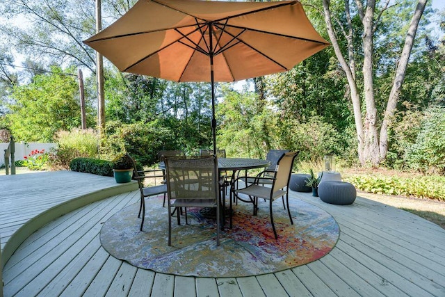 wooden terrace with outdoor dining space