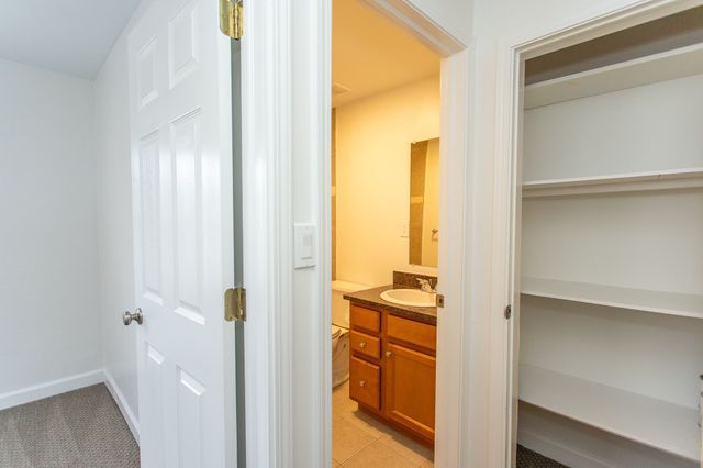 bathroom featuring vanity, baseboards, and tile patterned floors