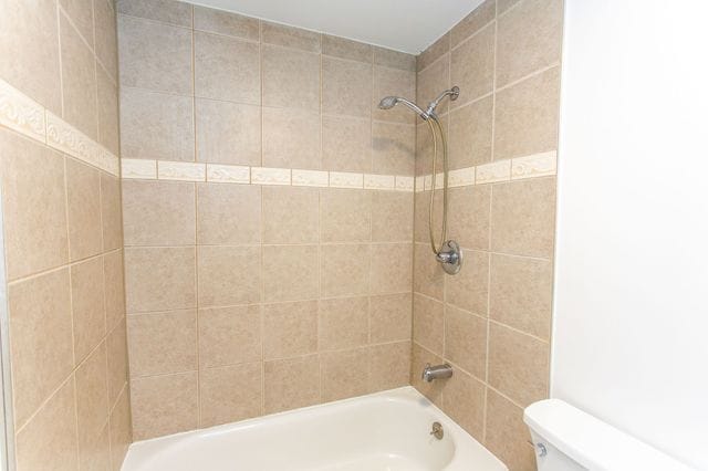 full bath with bathtub / shower combination and toilet