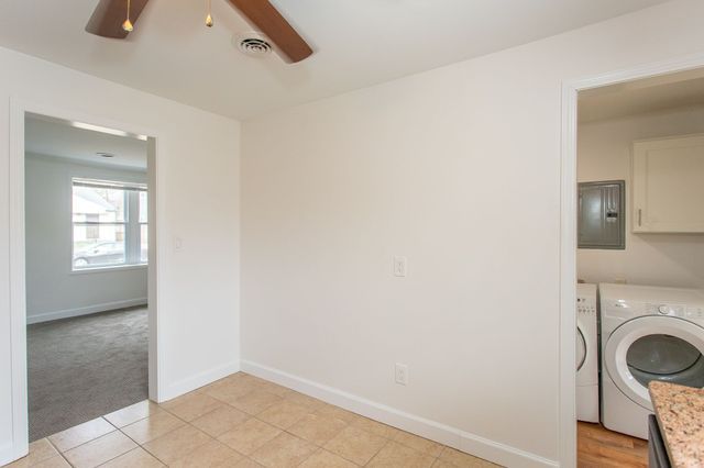 laundry area featuring visible vents, baseboards, independent washer and dryer, cabinet space, and electric panel