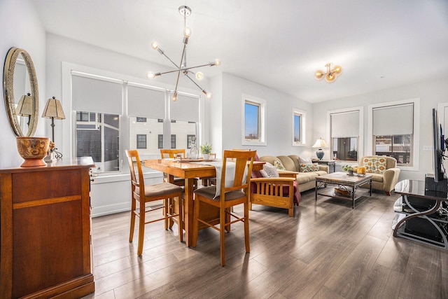 dining space featuring a chandelier and wood finished floors