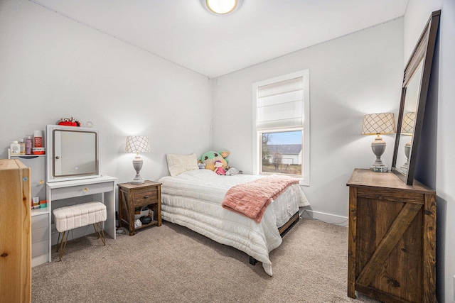 carpeted bedroom with baseboards