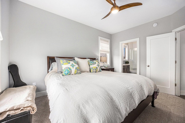 carpeted bedroom with a ceiling fan, connected bathroom, and baseboards