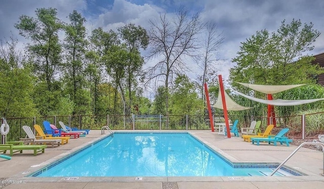 pool featuring a patio and fence