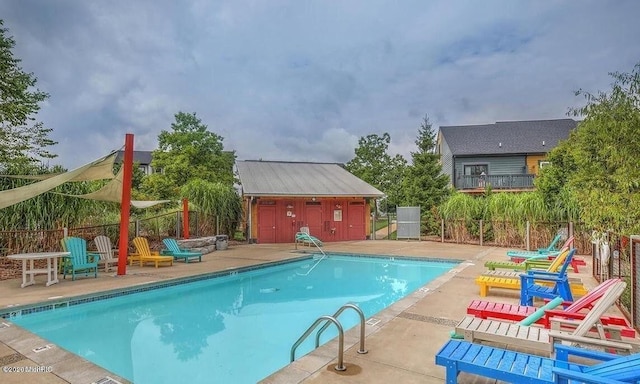 pool featuring a patio and fence