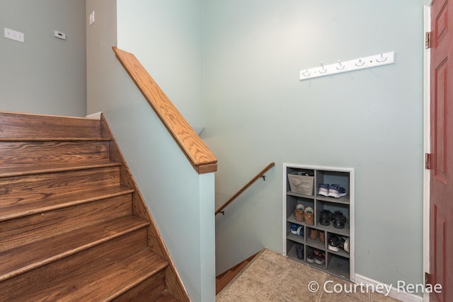 stairs with tile patterned floors