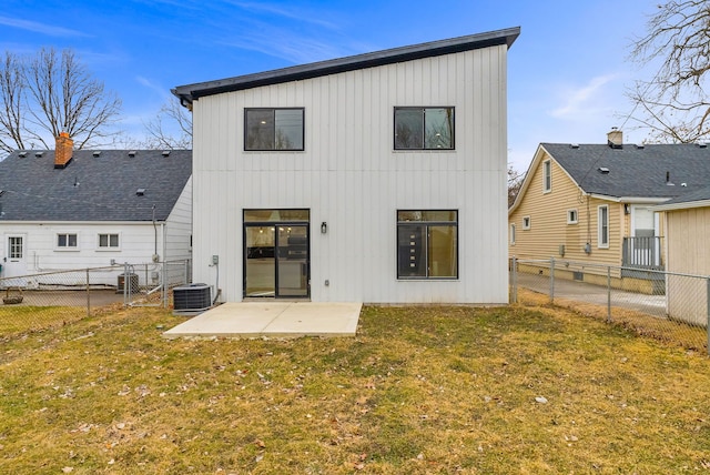 back of house with central air condition unit, a fenced backyard, a patio, and a yard