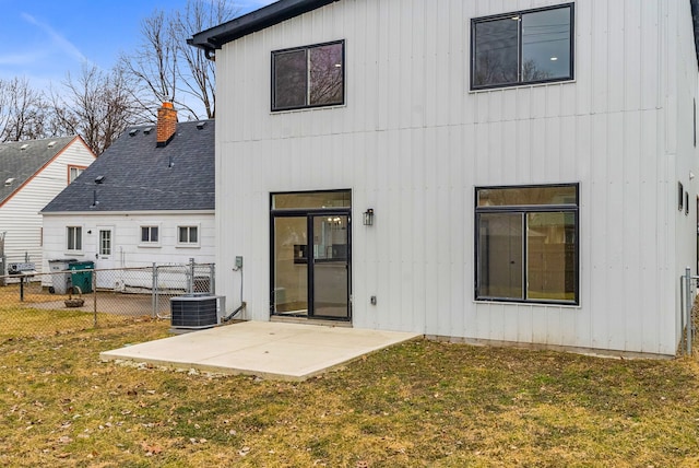 back of property featuring a patio, roof with shingles, fence, a yard, and central air condition unit