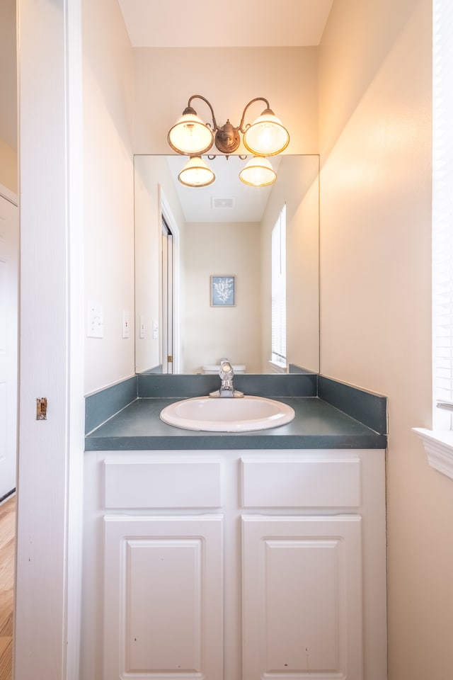 bathroom featuring visible vents and vanity