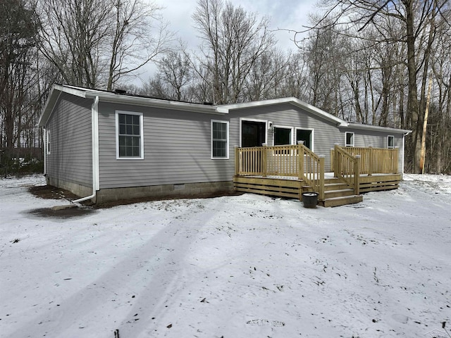 manufactured / mobile home featuring a wooden deck