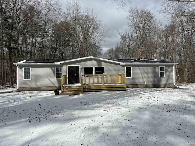 manufactured / mobile home with crawl space and a deck