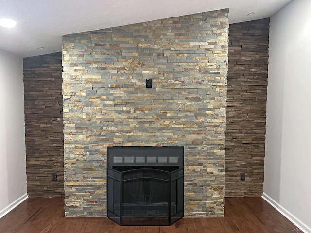 room details with baseboards and wood finished floors