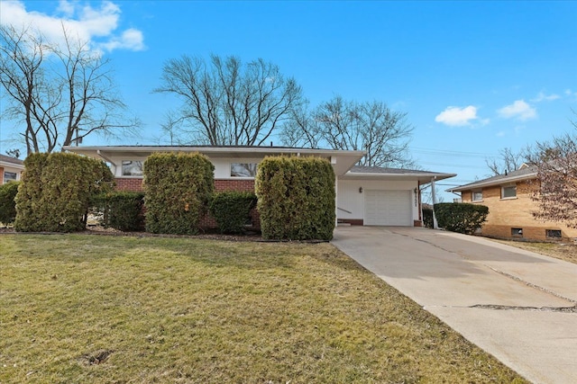 single story home with a front yard, concrete driveway, brick siding, and a garage