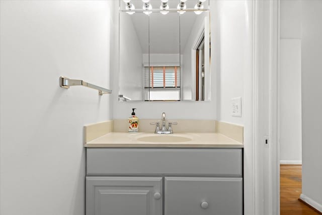 bathroom featuring vanity and wood finished floors