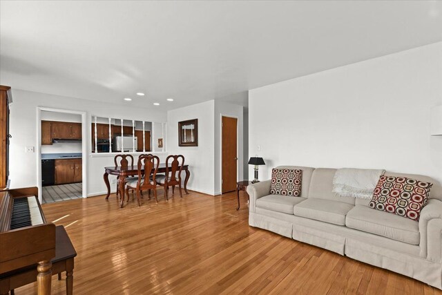 living room featuring recessed lighting and wood finished floors