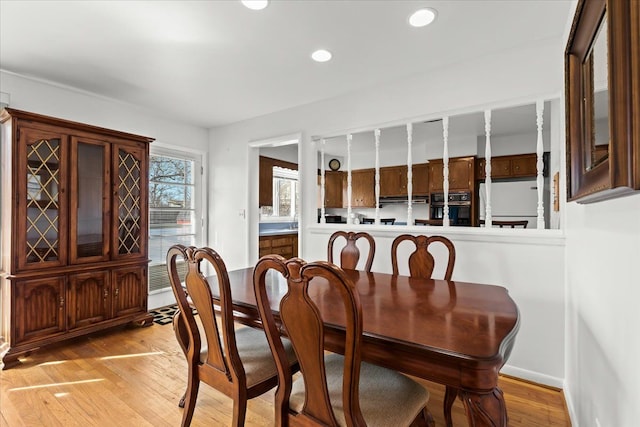 dining room featuring recessed lighting, baseboards, and light wood-style floors