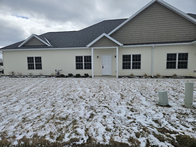 view of front of house with roof with shingles