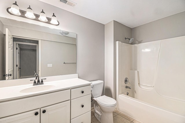 bathroom with toilet, vanity, visible vents, shower / washtub combination, and tile patterned floors