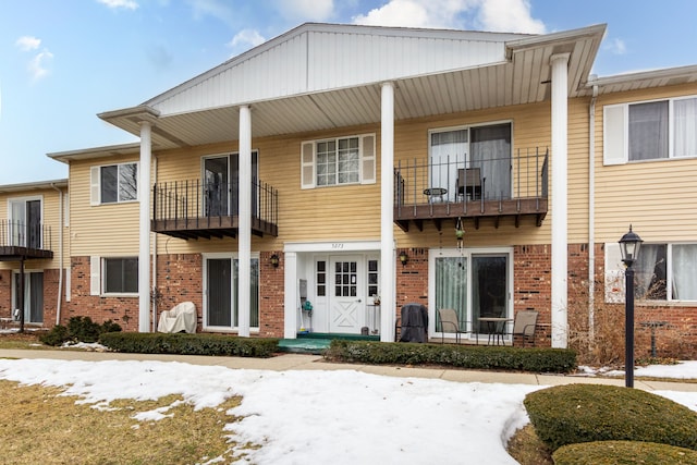 multi unit property featuring brick siding