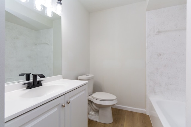 full bath with vanity, wood finished floors, toilet, and baseboards