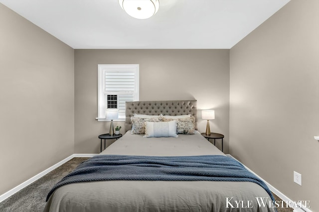 carpeted bedroom featuring baseboards