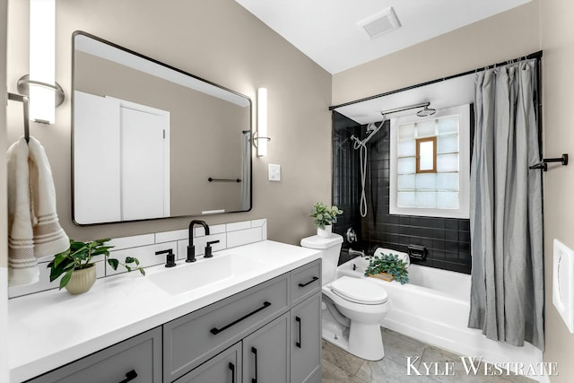 bathroom with shower / bath combination with curtain, visible vents, vanity, and toilet