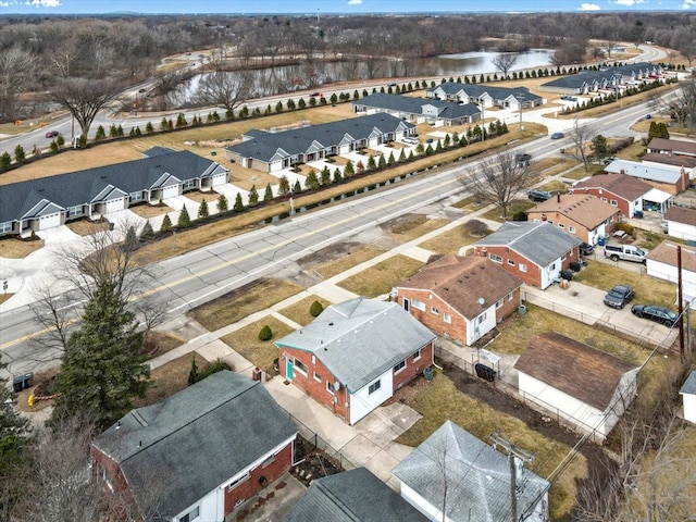 drone / aerial view featuring a water view and a residential view