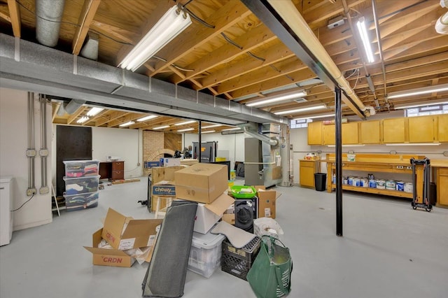 unfinished basement featuring gas water heater