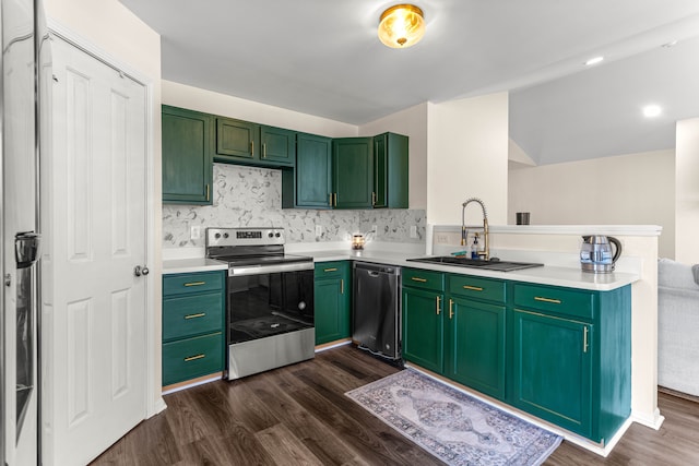 kitchen with a sink, a peninsula, dark wood-type flooring, and stainless steel appliances