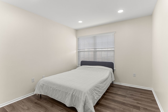 bedroom with recessed lighting, baseboards, and wood finished floors