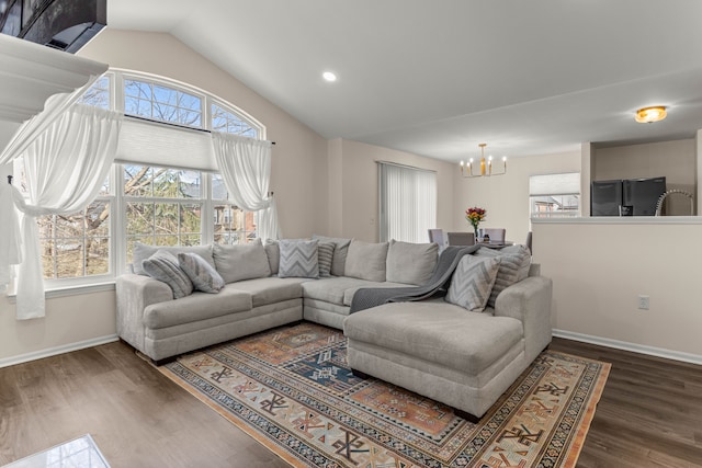 living area featuring wood finished floors, recessed lighting, baseboards, a chandelier, and vaulted ceiling