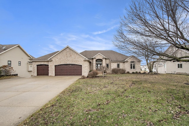 french country style house with driveway, a shingled roof, an attached garage, a front yard, and brick siding