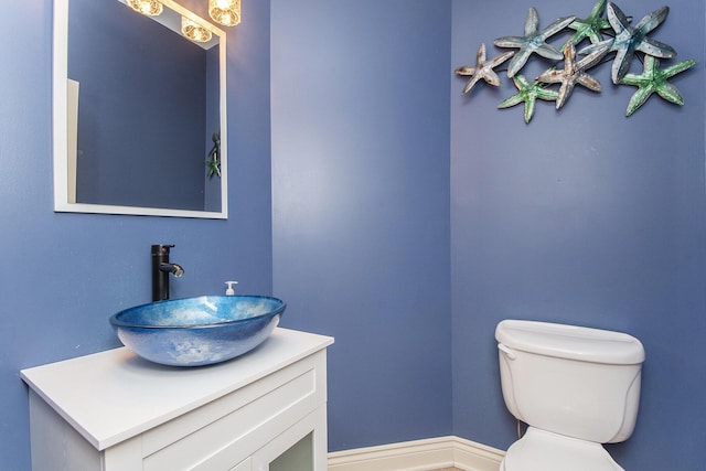 bathroom with toilet and vanity