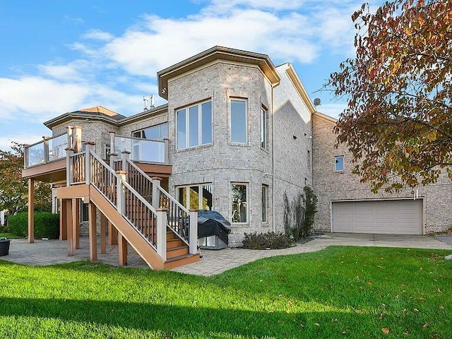 rear view of property featuring stairs, a patio, and a lawn