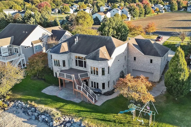 birds eye view of property with a residential view