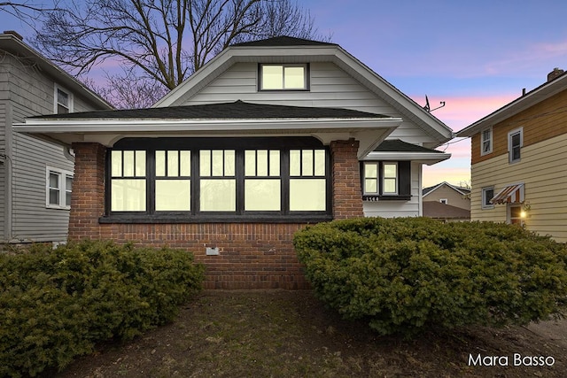 view of front of home featuring brick siding