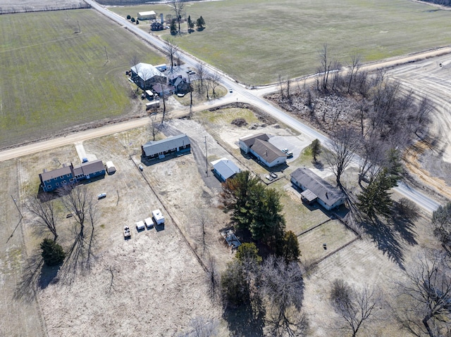 birds eye view of property with a rural view