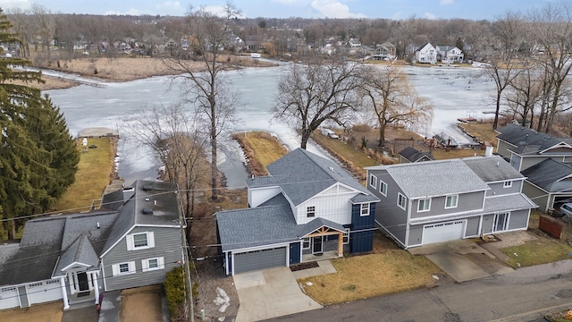 birds eye view of property with a residential view