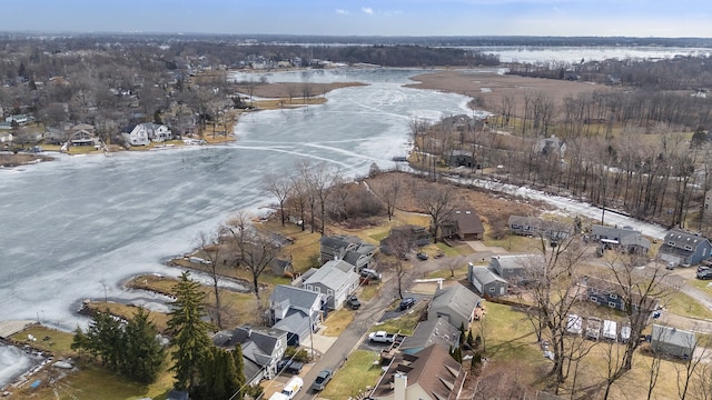 drone / aerial view with a water view and a residential view