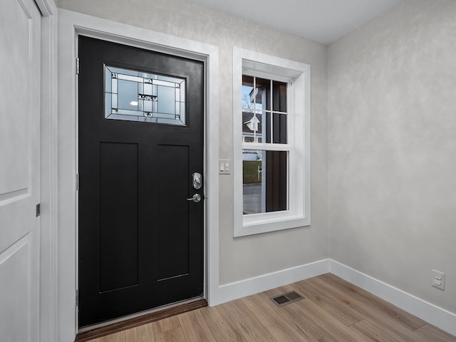 entrance to property featuring visible vents